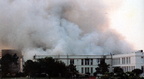 Smoke billows from Lee High School; Smoke billows from Lee High School following an early morning fire, April 29, 1987