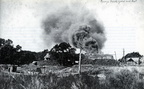 Fire from a brick kiln billows forth from the Casey brickyard