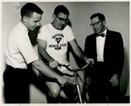 Jim Ainsworth tests YMCA's stationary bicycle.